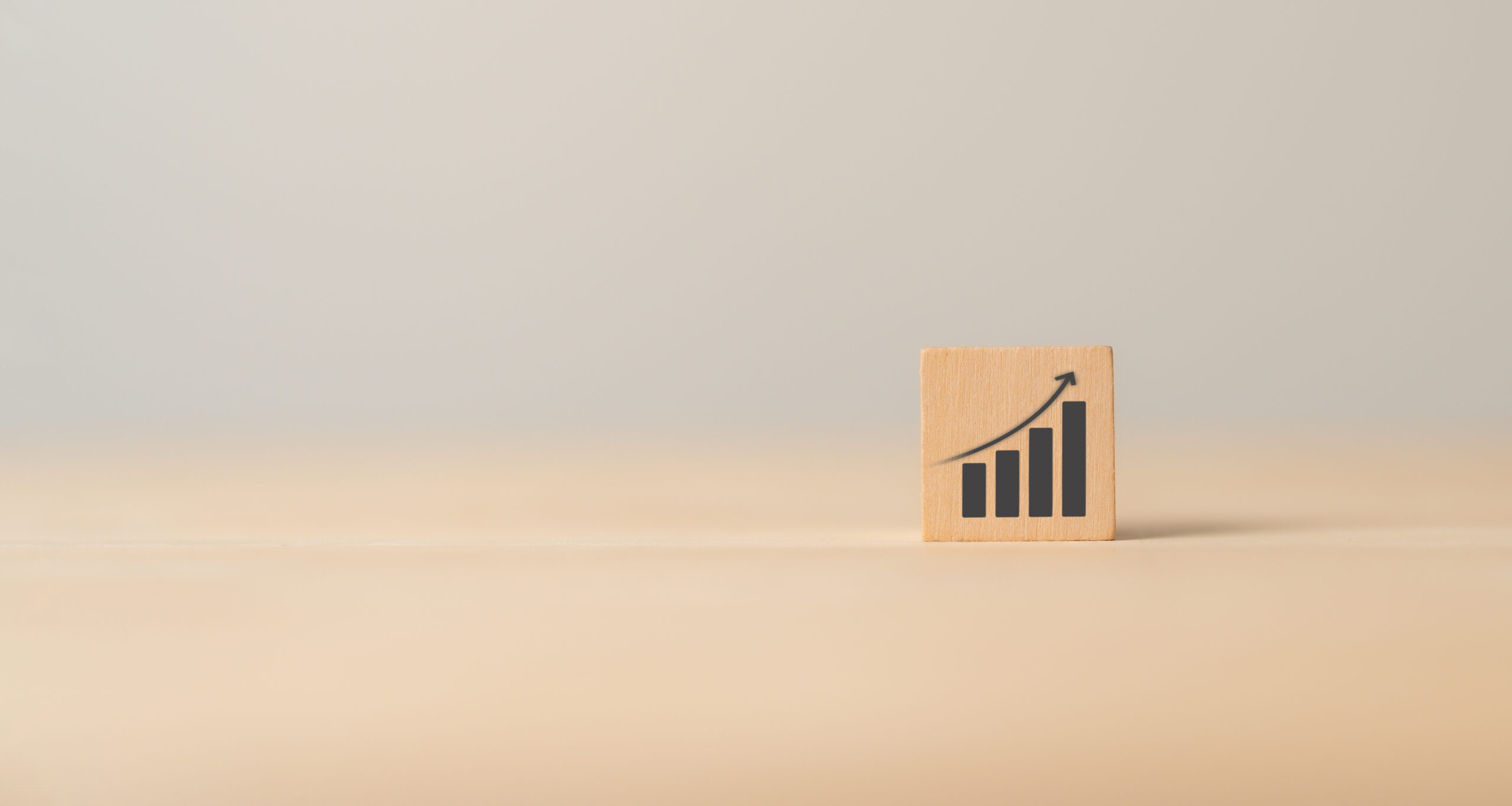 A tile on a blurry background - the tile contains an image of a growth curve / bar chart